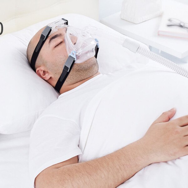 Man Asleep Wearing Wizard 220 Mask